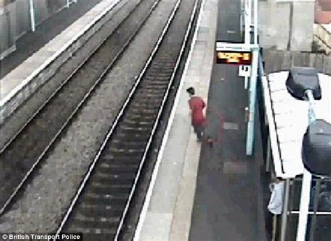 A SCHOOLBOY who was killed when he <b>jumped</b> under a <b>train</b> <b>in front</b> of 50 horrified classmates often spoke to pals about suicide, an inquest heard today. . Man jumps in front of train uk